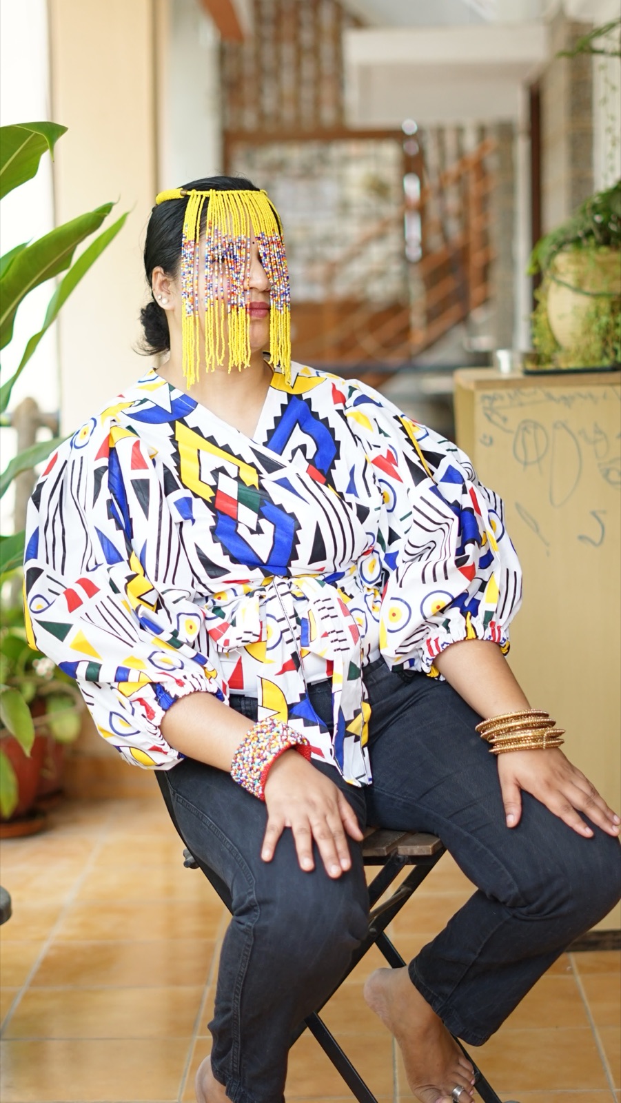 The wrap top seen from the front, model seated