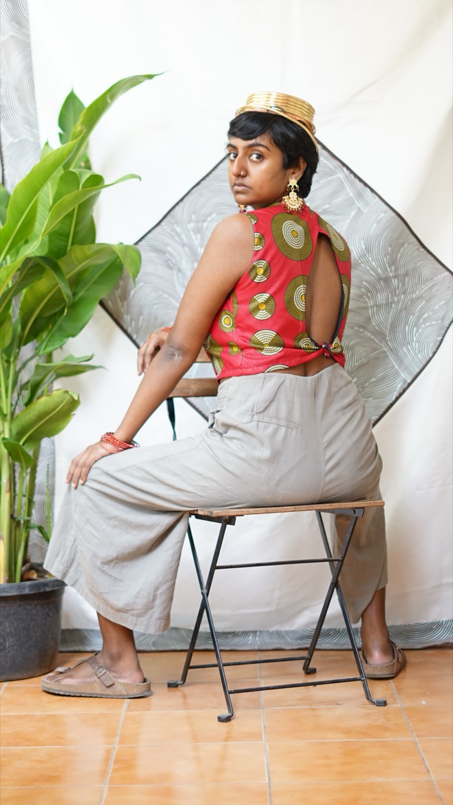 The open back of a pink wax-print top