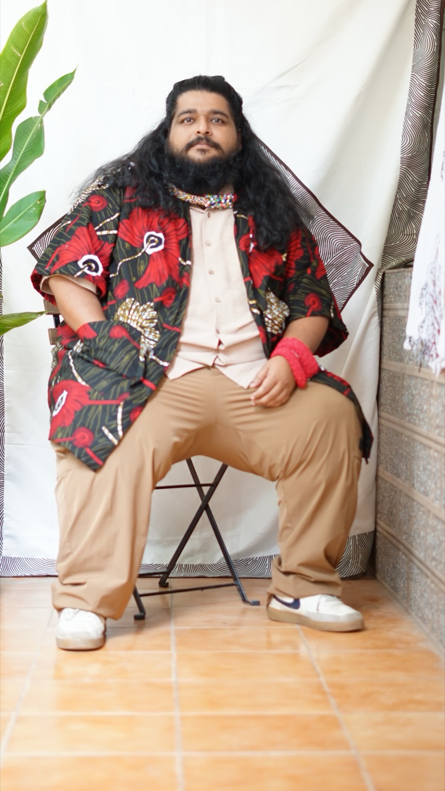 A flowing kimono in a black and red floral wax print
